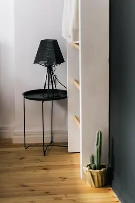 a table with a laptop on it in a room at Mouse House Kapana in Plovdiv