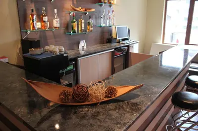 a bar with a wooden boat on top of a counter at Nevada Aparthotel in Pamporovo