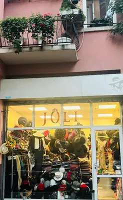 a store window with a lot of clothes on display at Lovely place in Sofia