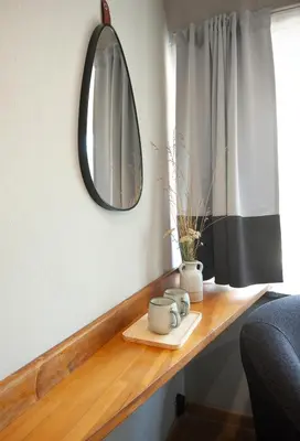 a mirror sitting on a wooden counter in a room at Park Hotel Ela in Borovets