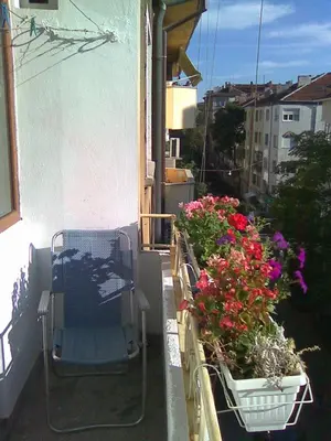 a balcony with some flowers on a building at Top Place in Downtown in Sofia