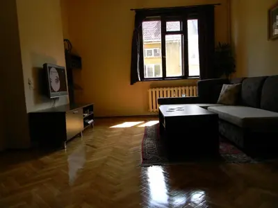 a living room with a couch and a table at Top Place in Downtown in Sofia