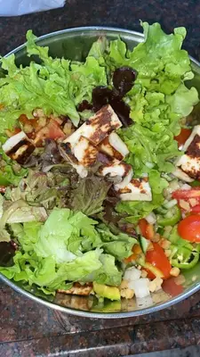 a salad in a bowl on a table at Hotel Elitza in Pamporovo