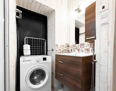 a bathroom with a washing machine and a sink at 2BDR Heart of Sofia AC Fully Equipped in Sofia