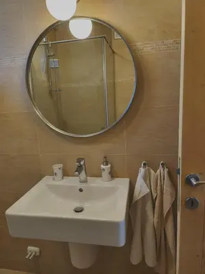 a bathroom with a sink and a mirror at Eco Residence in Ribarica