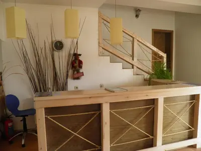 a tasting room with a table and a staircase at Pripetzite Hotel in Godlevo
