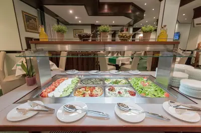 a buffet line with many different types of food at Hotel Bellevue - Half Board in Pamporovo