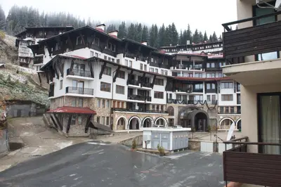 a large building in the middle of a mountain at Apartment 