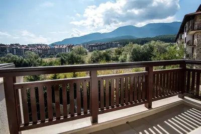 a balcony with a view of the mountains at Apart Hotel Orbilux in Bansko