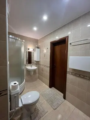 a bathroom with a toilet and a sink at Monastery 2 Aparthotel in Pamporovo