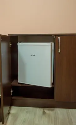 a white dishwasher in a cabinet in a room at Guest House Dinevi in Sapareva Banya