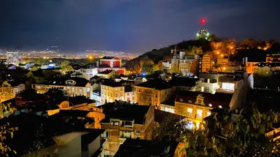 a view of a city at night at Къща Стария град in Plovdiv