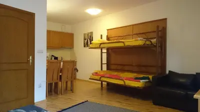 a room with two bunk beds and a couch at TES Royal Plaza Apartments in Borovets