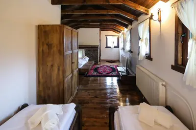 a hallway with two beds in a room at Yancheva Guest House in Delchevo