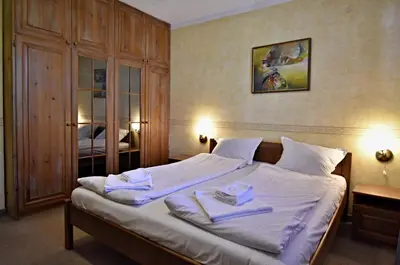 a bedroom with a bed with two towels on it at Art Spa Villa Gal in Velingrad
