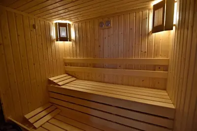 a wooden sauna with a bench in a room at Art Spa Villa Gal in Velingrad