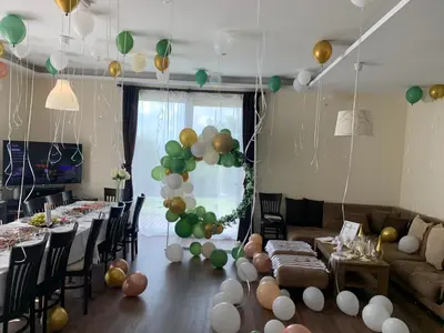 a living room with a bunch of balloons and tables at Vakarel Residence in Vakarel