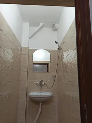 a bathroom with a sink and a shower at Guest House Ganovi in Kalofer