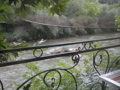 a view of a river from a wrought iron railing at Hotel- Restaurant Struma in Stara Kresna