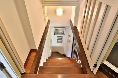 a staircase in a home with wooden floors at Portofino Apartment in Sofia