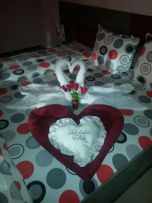 two hearts are laid out on a bed at Family Hotel Yola in Chepelare
