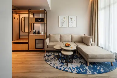 a living room with a couch and a table at Hyatt Regency Pravets Resort in Pravets