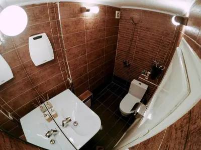 a bathroom with a white sink and a toilet at Studio 5 Corners in Sofia