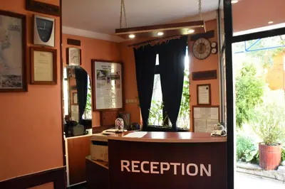 a shop with a reception desk and a window at Medic Hotel in Sofia
