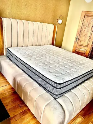 a mattress sitting on a bed in a room at City Center Stylish 3 Bedroom Apartment in Sofia