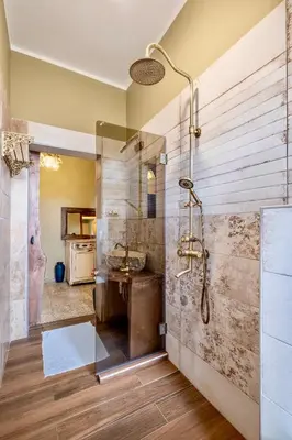 a bathroom with a shower and a sink at City Center Stylish 3 Bedroom Apartment in Sofia