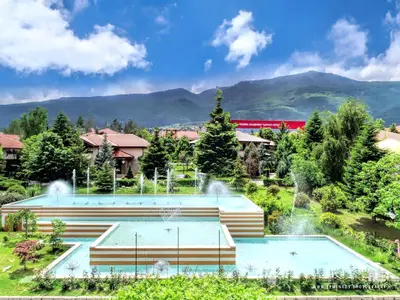 a resort with two pools and a fountain at Tsarsko Selo Spa Hotel in Sofia