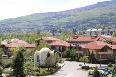 a small town with a mountain in the background at Tsarsko Selo Spa Hotel in Sofia