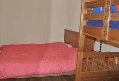 a bedroom with a bunk bed and a ladder at Feels like Home 