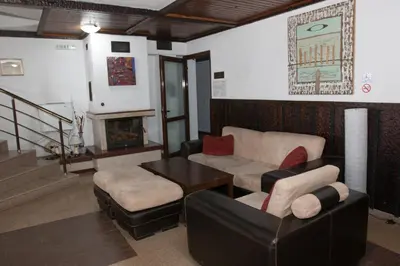 a living room with a couch and a table at Feels like Home 