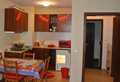 a kitchen with a table and a dining room at Feels like Home 