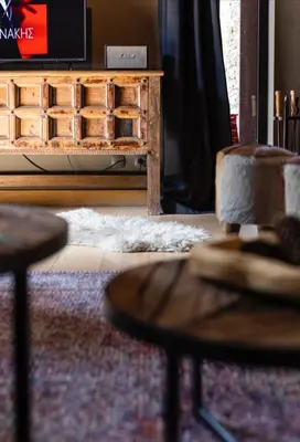 a living room with a wooden table and chairs at Borovets Chalets in Borovets