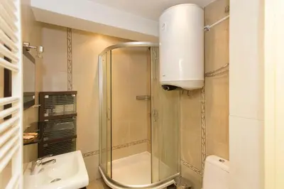 a bathroom with a shower and a sink at Sofia Central Hotel Apartments in Sofia