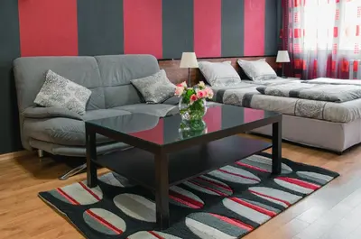 a living room with a couch and a glass coffee table at Sofia Central Hotel Apartments in Sofia