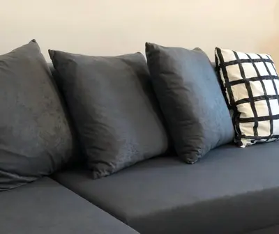 four pillows sitting on top of a couch at Terra Guest House in Velingrad