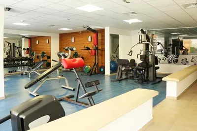 a fitness room with a gym with cardio equipment at White Lavina - Ski, Bike, Hike in Bansko