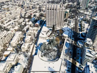 an aerial view of a city with snow covered buildings at Hotel Marinela Sofia in Sofia
