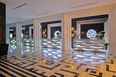 a lobby with a glass floor and two windows at Hotel Marinela Sofia in Sofia