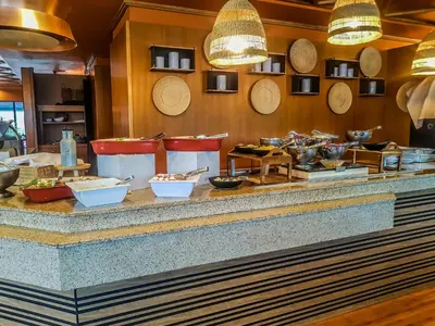 a buffet line with various food items on it at Hotel Marinela Sofia in Sofia