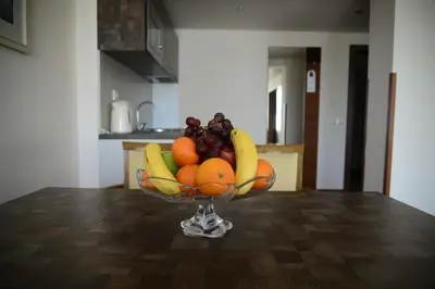 a bowl of fruit sitting on top of a table at Hotel Forum - Free Parking for cars in Sofia