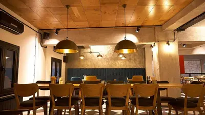 a dining room with a table and chairs at Hotel Lion Sofia in Sofia