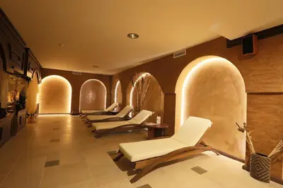 a row of white chairs in a waiting room at Royal Park Spa Bansko, private apartments within the complex in Bansko