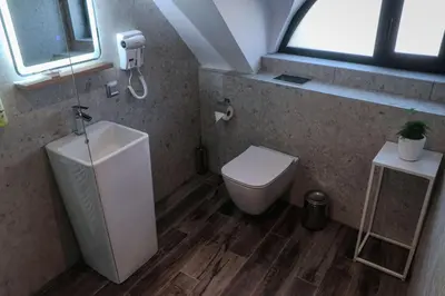 a small bathroom with a toilet and a window at Best Western Plus Lozenetz Hotel in Sofia