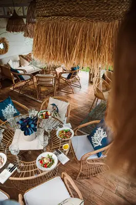 a table with plates of food on top of it at Spa Hotel Ezeretz Blagoevgrad in Blagoevgrad
