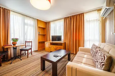 a living room with a couch and a table at Hotel Avion - Self check in in Plovdiv