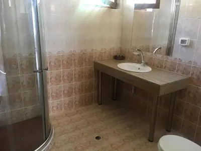 a bathroom with a sink and a shower at Hotel Gloria Palace Diplomat in Sofia